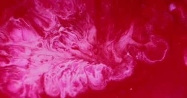 Karışım akışı. Renkli su. Soyut sanat arkaplanına yayılan pembeleşmiş kırmızı kırmızı mermer dokusu sıvı boya emülsiyonu.