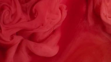 Duman mürekkebi. Fış sanatı. Soyut akrilik zemin üzerinde yüzen akrilik su karışımı sisli, pembemsi kırmızı sıvı doku..