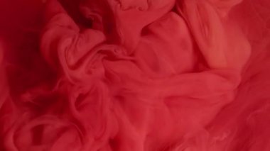 Döndürme sıvısı. Bulut mürekkebi. Odaklanamayan pembe kırmızı duman sıvı egzoz kimyasal dokusu sanatın soyut yaratıcı arka planına yayılıyor.