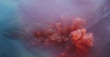 Dönen sis. Sıçrama sanatı. Odaklanmamış turuncu mavi renkli parlak mürekkep dokusu soyut yaratıcı arka planda yüzen parlak sıvı..