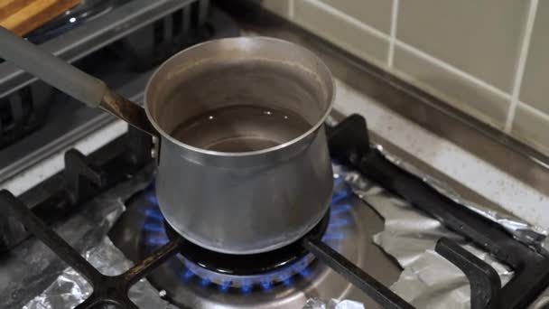 Boiling Water Turkish Coffee Warmer Gas Stove Closeup Orbit Shot — Stock Video