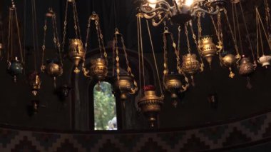 Sanctuary lamps hanging from the ceiling in the Christian church interior