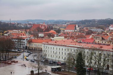 Vilnius, Lithuania - 22-03-2017 - View from above of the tiled roofs of the old town of Vilnius from the clock tower clipart