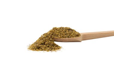 dried common chamomile flowers in latin - Matricaria chamomilla  on wooden spoon isolated on white background. Medicinal herb. 