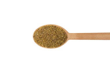 dried common chamomile flowers in latin - Matricaria chamomilla  on wooden spoon isolated on white background. Medicinal herb. 