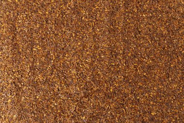 Rooibos tea medium cut background. Rooibos in latin Aspalathus linearis. herb. herbal tea. food ingredient.