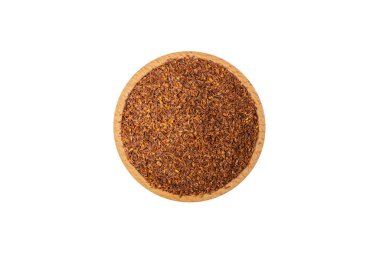Rooibos tea medium cut in wooden bowl isolated on white background. Rooibos in latin Aspalathus linearis. herb. herbal tea. food ingredient.