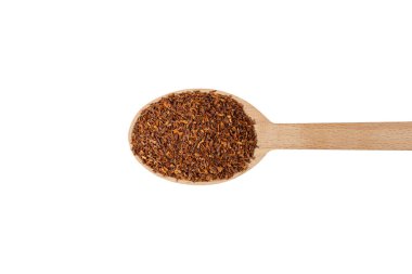 Rooibos tea medium cut on wooden spoon isolated on white background. Rooibos in latin Aspalathus linearis. herb. herbal tea. food ingredient.