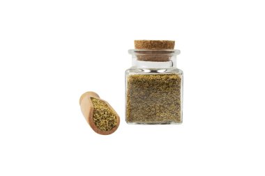 dried common chamomile flowers in latin - Matricaria chamomilla  in wooden scoop and glass jar on isolated on white background. Medicinal herb. 