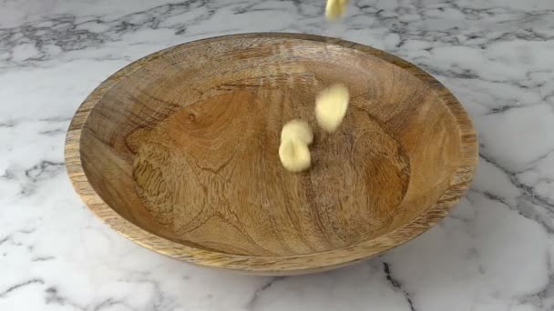 Orecchiette Pasta Falling Wooden Bowl Marble Worktop Background — Stock Video