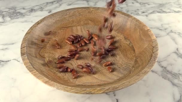 Pinto Beans Falling Wooden Plate Slow Motion — Stock Video