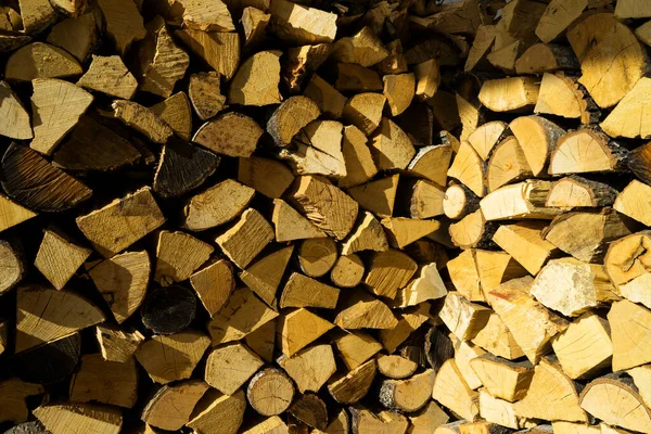 stock image pile of firewood, wooden logs. texture of natural wood.