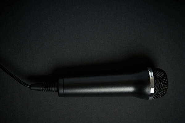 Black microphone on black background