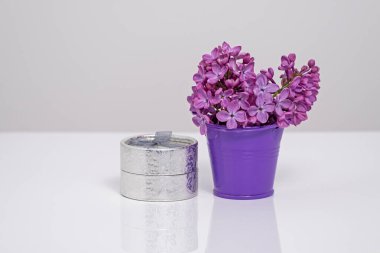 Lilac flowers and holidays gifts. Gift on Valentine Day or birthday. Concept of Valentine Day, wedding, birthday holidays. St. Valentine Day
