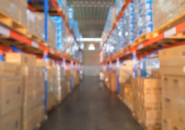 stock image Blurry bokeh abstract background of interior of large warehouse retail store industry. Rack of furniture and home accessories stock storage. Interior of cargo in ecommerce and logistic concept. Depot