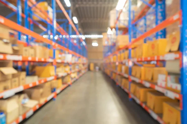 stock image Blurry bokeh abstract background of interior of large warehouse retail store industry. Rack of furniture and home accessories stock storage. Interior of cargo in ecommerce and logistic concept. Depot