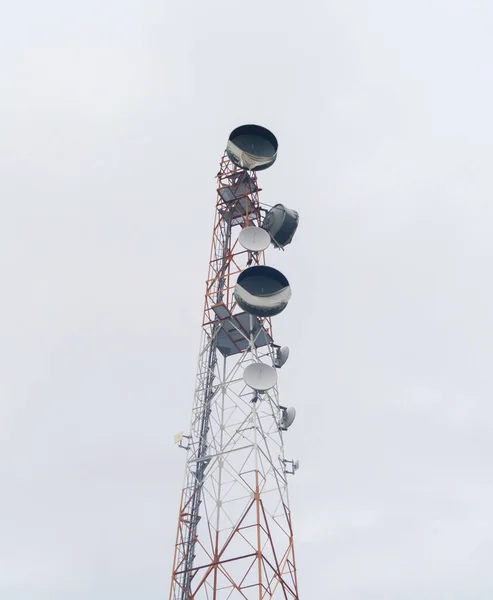 TV radio antenna network telecom tower isolated on white. Station