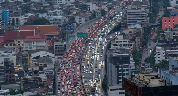 stock image Aerial view of busy cars with traffic jam in the rush hour on highway road street on bridge in Bangkok Downtown, urban city in Asia, Thailand at sunset. Intersection junction. Toll gate in Rama 9