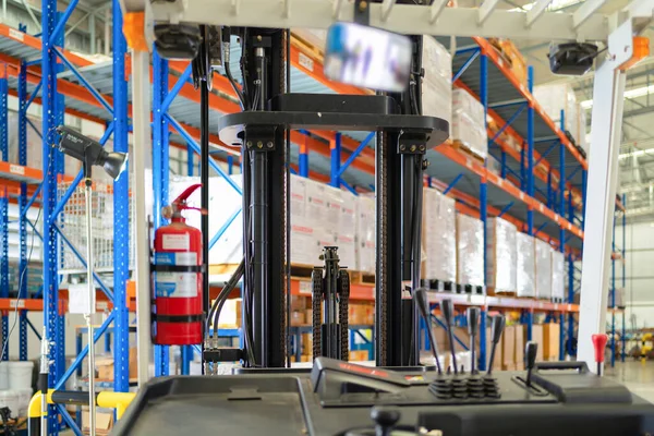 Fork lift truck with pallet car vehicle working of large warehouse retail store industry. Rack of furniture and stock storage. Interior of cargo in ecommerce and logistic concept. Depot transportation