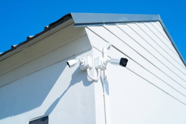 CCTV security camera or closed circuit television at building exit way at home or house. Digital safety and motion recorder. Video surveillance. Technology monitor.