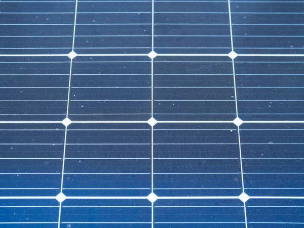 Solar panels or solar cells on the rooftop of factory industry building. Power plant in urban city, renewable energy source. Eco technology for electric power.