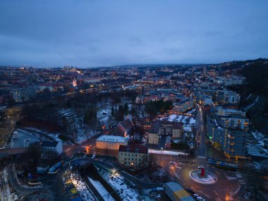 Aerial view of Oslo Downtown Skyline, Norway. Financial district and business centers in smart urban city in Europe. Skyscraper and high-rise buildings at night.
