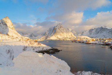 White snow mountain in Lofoten islands, Nordland county, Norway, Europe. Hills and trees, nature landscape in winter season. Winter background.