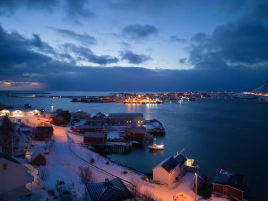 White snow mountain in Lofoten islands, Nordland county, Norway, Europe. Hills and trees, nature landscape in winter season. Winter background.