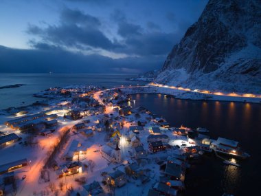 White snow mountain in Lofoten islands, Nordland county, Norway, Europe. Hills and trees, nature landscape in winter season. Winter background.