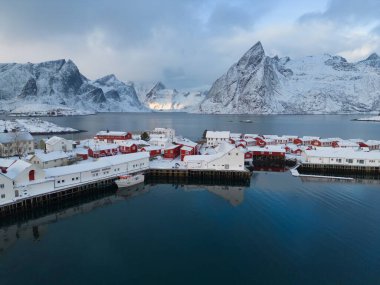 White snow mountain in Lofoten islands, Nordland county, Norway, Europe. Hills and trees, nature landscape in winter season. Winter background.