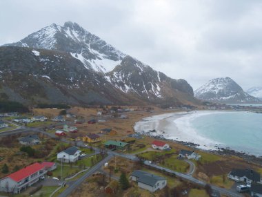 White snow mountain in Lofoten islands, Nordland county, Norway, Europe. Hills and trees, nature landscape in winter season. Winter background.