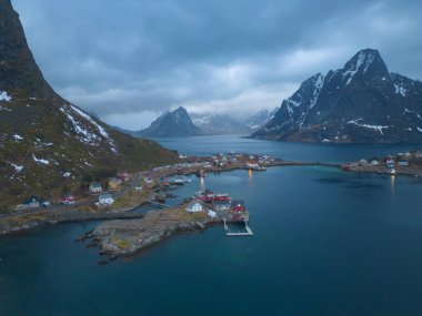 White snow mountain in Lofoten islands, Nordland county, Norway, Europe. Hills and trees, nature landscape in winter season. Winter background.