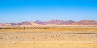 Namib Çölü Safarisi Namibya, Güney Afrika 'da kum tepecikli. Gün batımında doğal manzara. Ünlü turist eğlencesi. Büyük Kanyon 'da kum