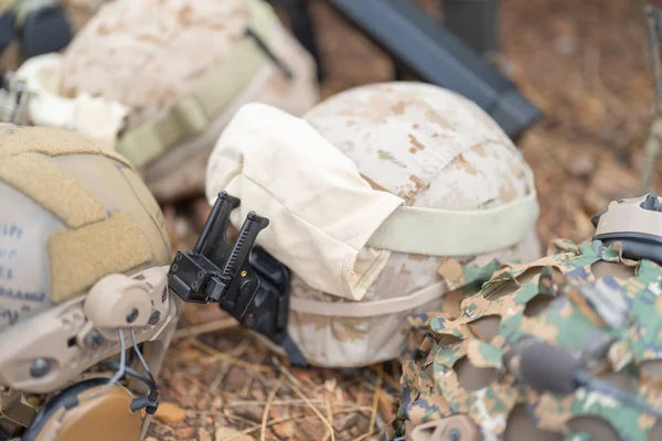 Gun weapons bags and helmets for Army marine corps soldier military war participating and preparing to attack the enemy in Thailand during Exercise Cobra Gold in battle. Combat force training.