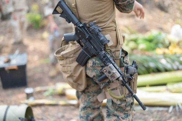 stock image Team of U.S. Army marine corps soldier military war with gun weapon participating and preparing to attack the enemy in Thailand during exercise Cobra Gold training in battle. Combat force.