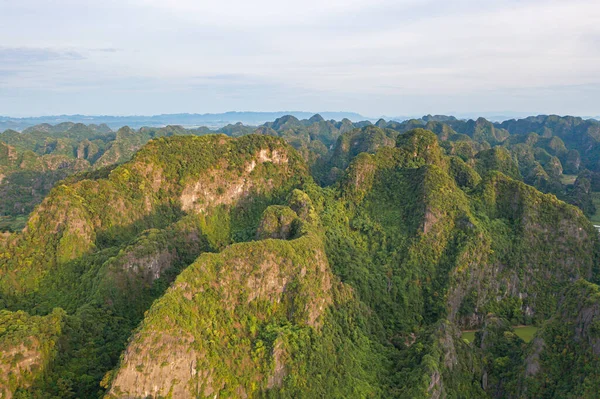 stock image Aerial top view of fresh paddy rice, green agricultural fields with mountain hills valley in countryside or rural area of Ninh Binh, in Asia, Vietnam. Nature landscape background.