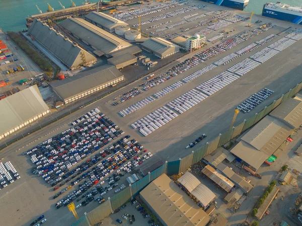 stock image Aerial top view of new cars parking for sale stock lot row, dealer inventory import and export business commercial worldwide, Automobile and automotive industry distribution logistic global transport