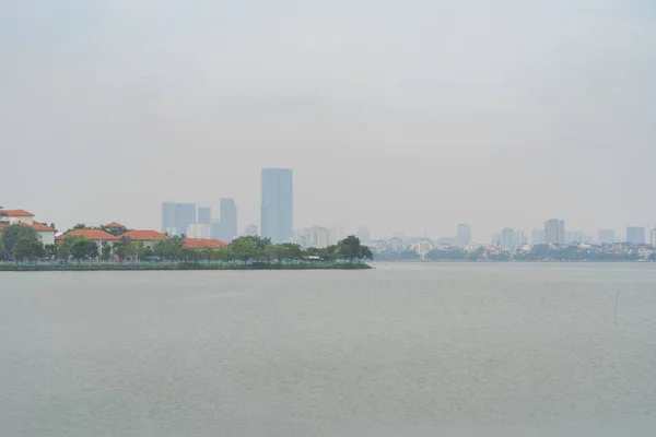 stock image Reflection of Hanoi Downtown Skyline, Vietnam with lake and river. Financial district and business centers in smart urban city in Asia. Skyscraper and high-rise buildings.