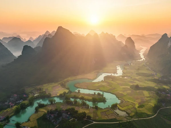 stock image Aerial top view of fresh paddy rice terraces, green agricultural fields in countryside or rural area of Cao Bang, mountain hills valley in Asia, Vietnam, China border. Nature landscape background.