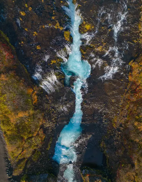 Aerial top view of Bruarfoss waterfall in autumn season in Iceland. Famous nature landscape background