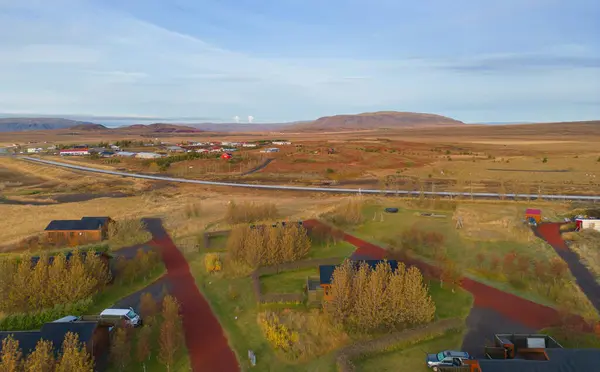 Stock image Aerial top view of houses or hotel with mountains in Iceland islands in the summer season, Europe hills, nature landscape background.