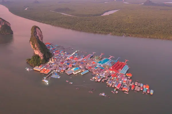 Aerial view of Koh Panyee, The Floating village urban city town houses, lake sea or river. Nature landscape fisheries and fishing tools at Pak Pha, Phang Nga, Thailand. Aquaculture farming