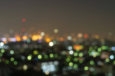 Bangkok, Tayland 'daki gökdelen binalarının soyut arkaplanı Bokeh, gece vakti bulanık fotoğraf. Şehir manzarası.