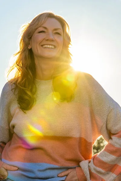 Attractive Happy Smiling Middle Aged Woman Back Lit Warm Sunshine — Stockfoto