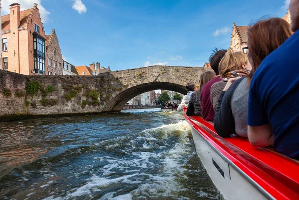 Tourists on a sight seeing boat trip around Bruges in Belgium on the Brugge Zeebrugge Canal