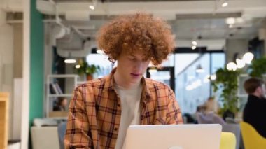 Amazed male professional winner feeling happy receiving new job opportunity, reward bonus, celebrates financial market growth concept. Excited business man checking email reading great news on laptop