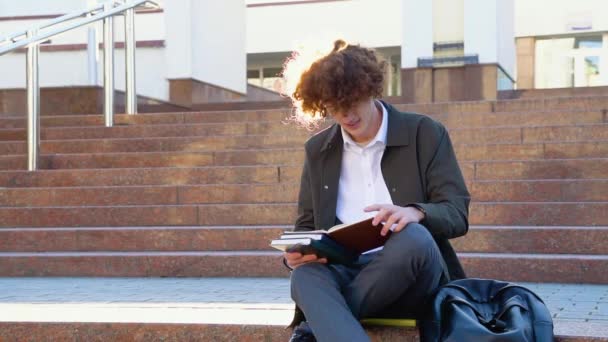 Young Red Haired Curly Student Sits Stairs Reads Books University — Stock Video