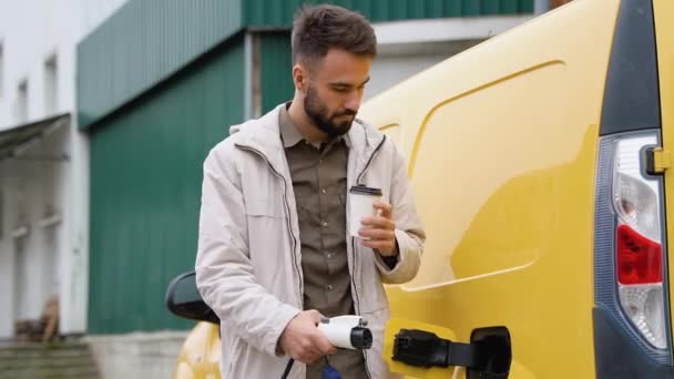Man Plugging Charging Cable Electric Vehicle Charges Batteries Male Hand — Stock Video