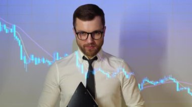 Confident professional businessman looking in camera with stock trade or cryptocurrency graph in background.