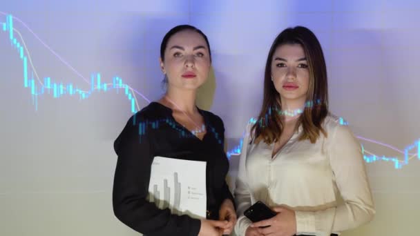 Two Confident Professional Business Woman Office Background Financial Chart — 비디오